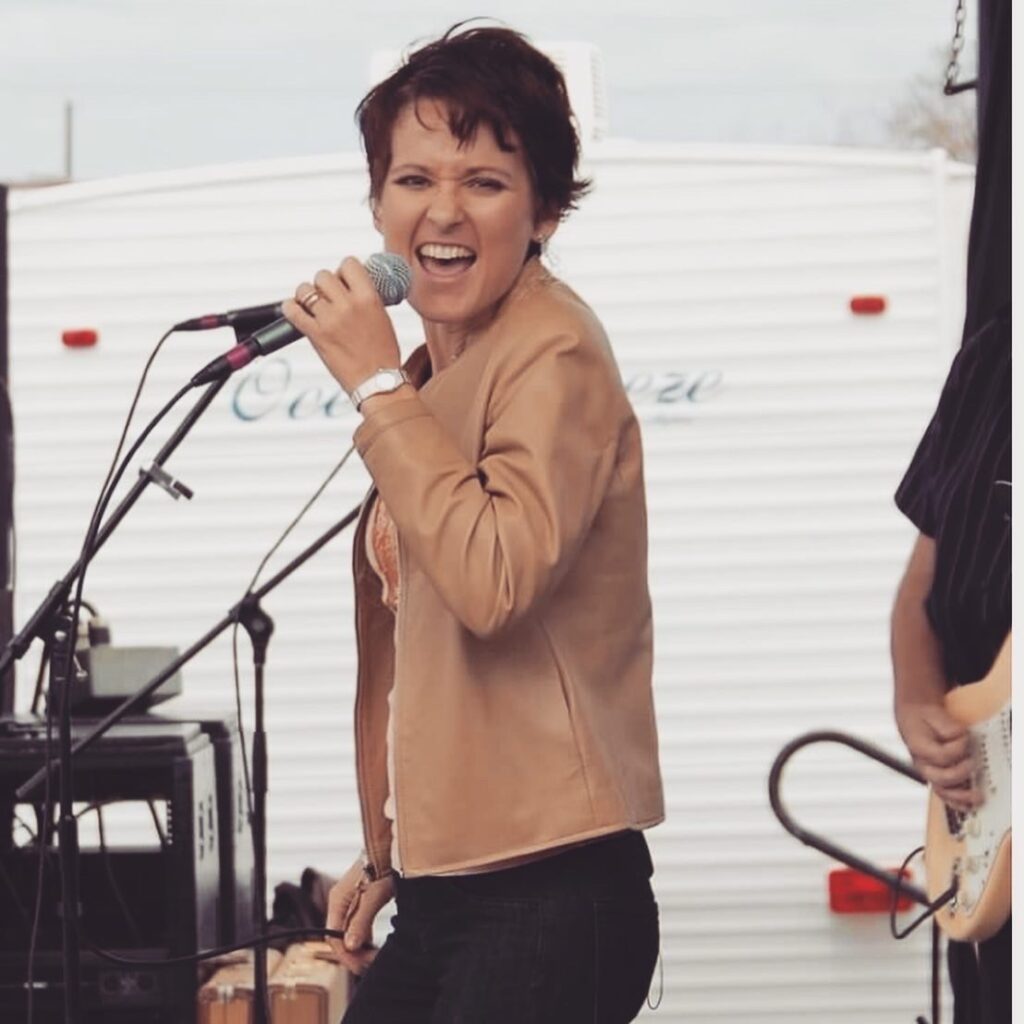 Dr. Ginger Garner singing soul onstage at NC Seafood Festival 